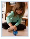Hanukkah poster or puzzle - child spinning a dreidel.  